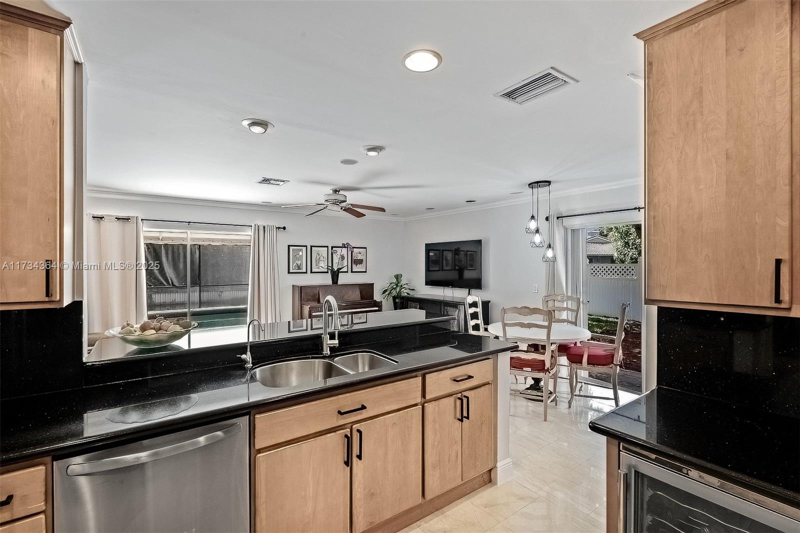 7260 Northwest 4th Avenue Boca Raton, FL 33487 - Photo 22 of 59 a kitchen with sink stove and refrigerator