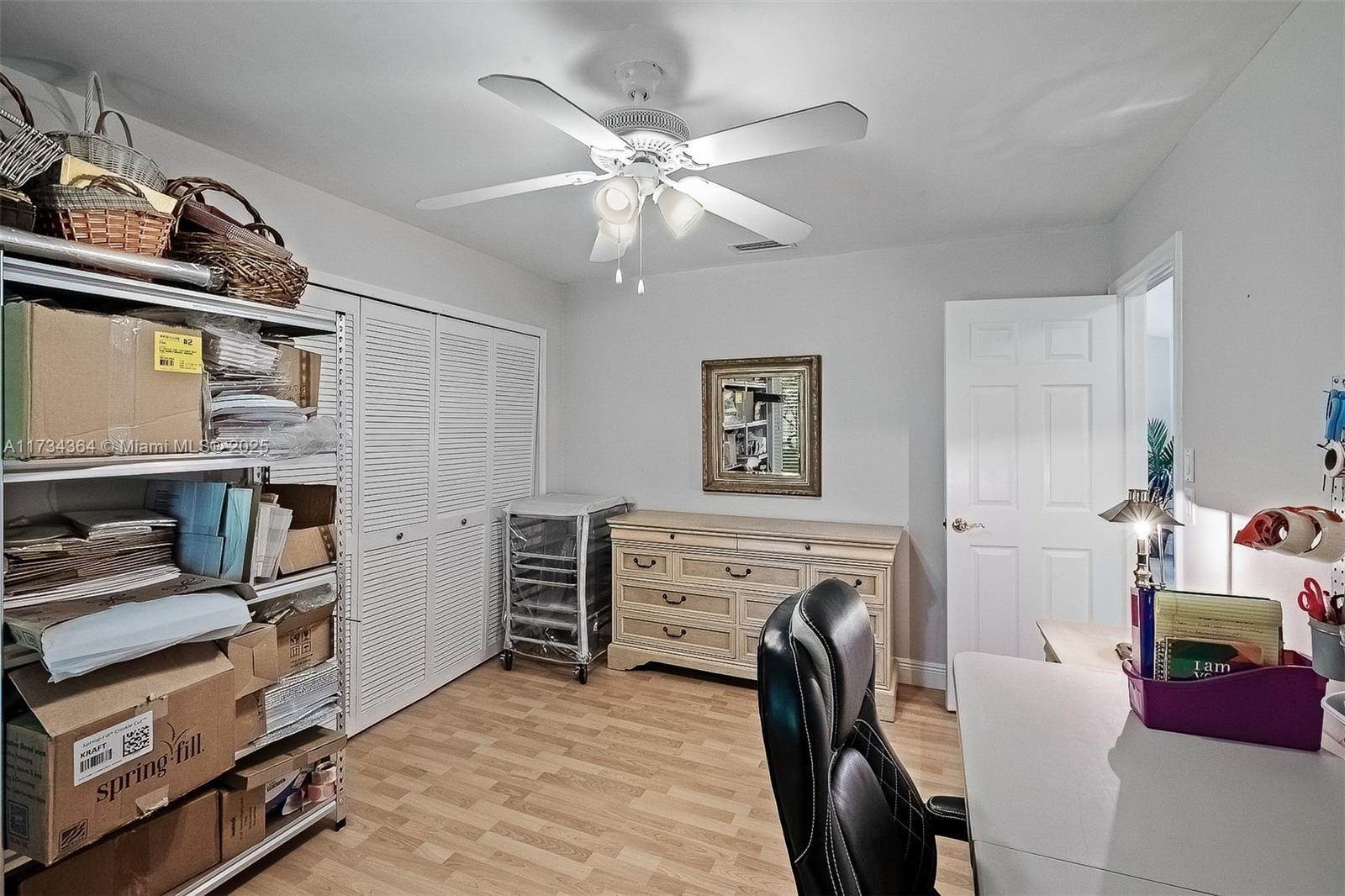 7260 Northwest 4th Avenue Boca Raton, FL 33487 - Photo 26 of 59 a view of a livingroom with furniture and a ceiling fan