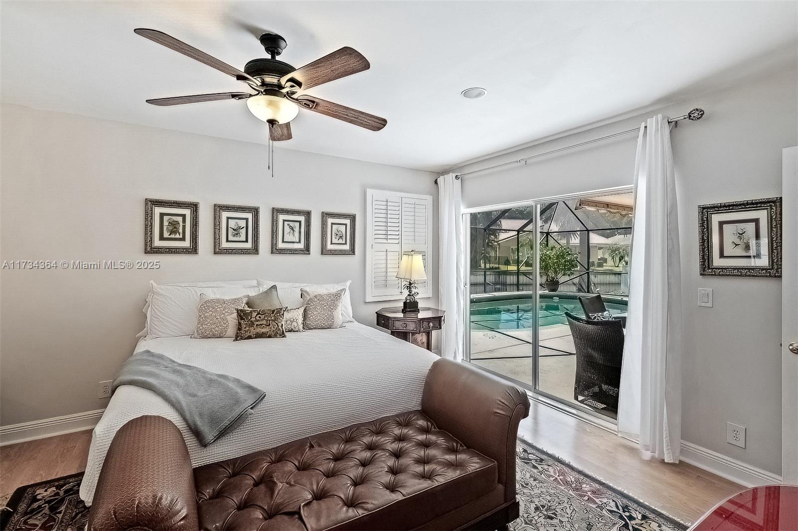 7260 Northwest 4th Avenue Boca Raton, FL 33487 - Photo 30 of 59 a bedroom with a bed and a couch