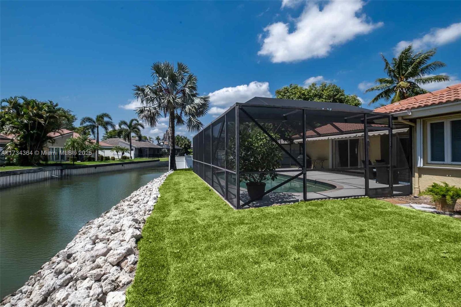 7260 Northwest 4th Avenue Boca Raton, FL 33487 - Photo 3 of 59 a view of a house with a yard