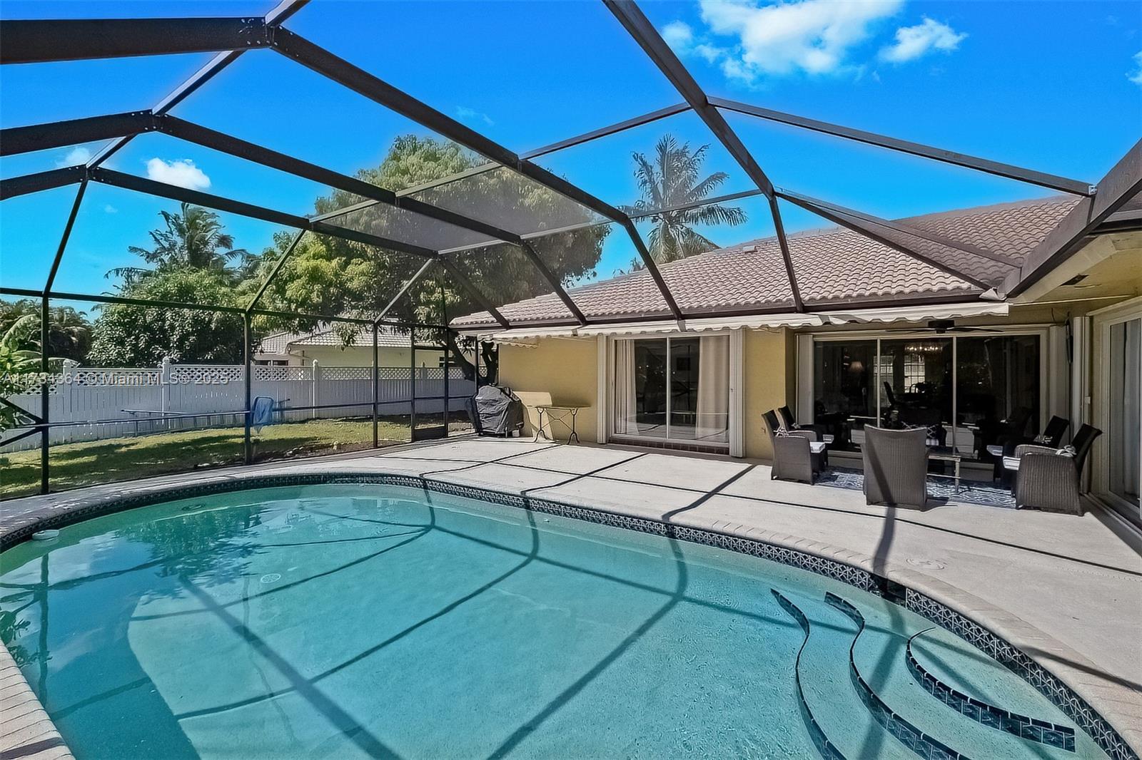 7260 Northwest 4th Avenue Boca Raton, FL 33487 - Photo 42 of 59 a view of a backyard with sitting area