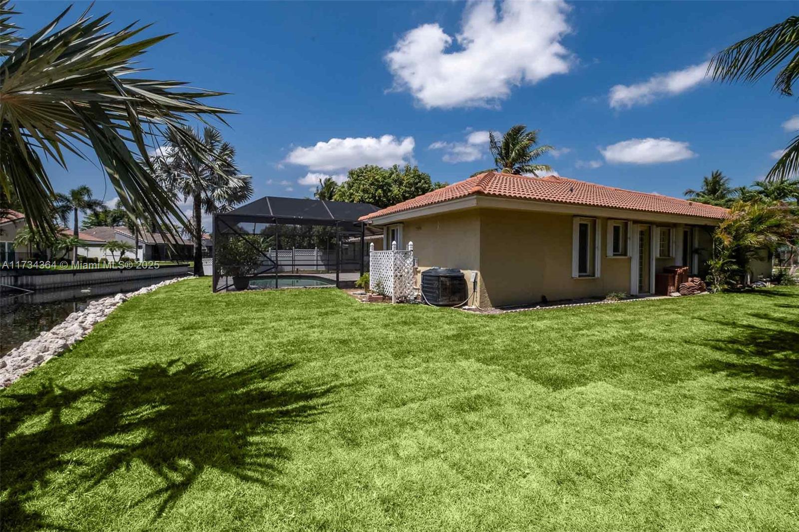 7260 Northwest 4th Avenue Boca Raton, FL 33487 - Photo 46 of 59 a view of a house with a yard