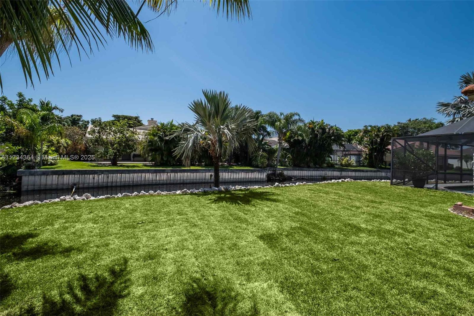 7260 Northwest 4th Avenue Boca Raton, FL 33487 - Photo 54 of 59 a view of a yard with a tree