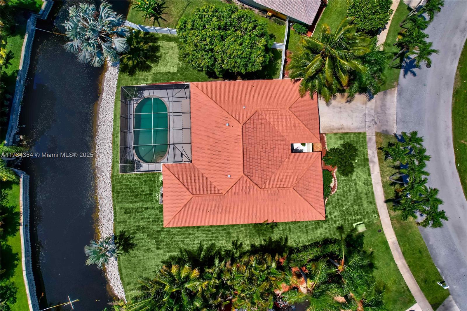 7260 Northwest 4th Avenue Boca Raton, FL 33487 - Photo 56 of 59 an aerial view of a house with a yard and potted plants