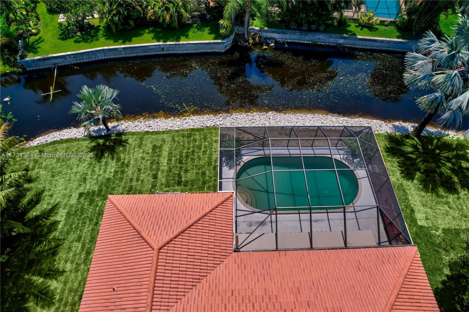 7260 Northwest 4th Avenue Boca Raton, FL 33487 - Photo 57 of 59 a view of a patio with table and chairs potted plants with wooden floor