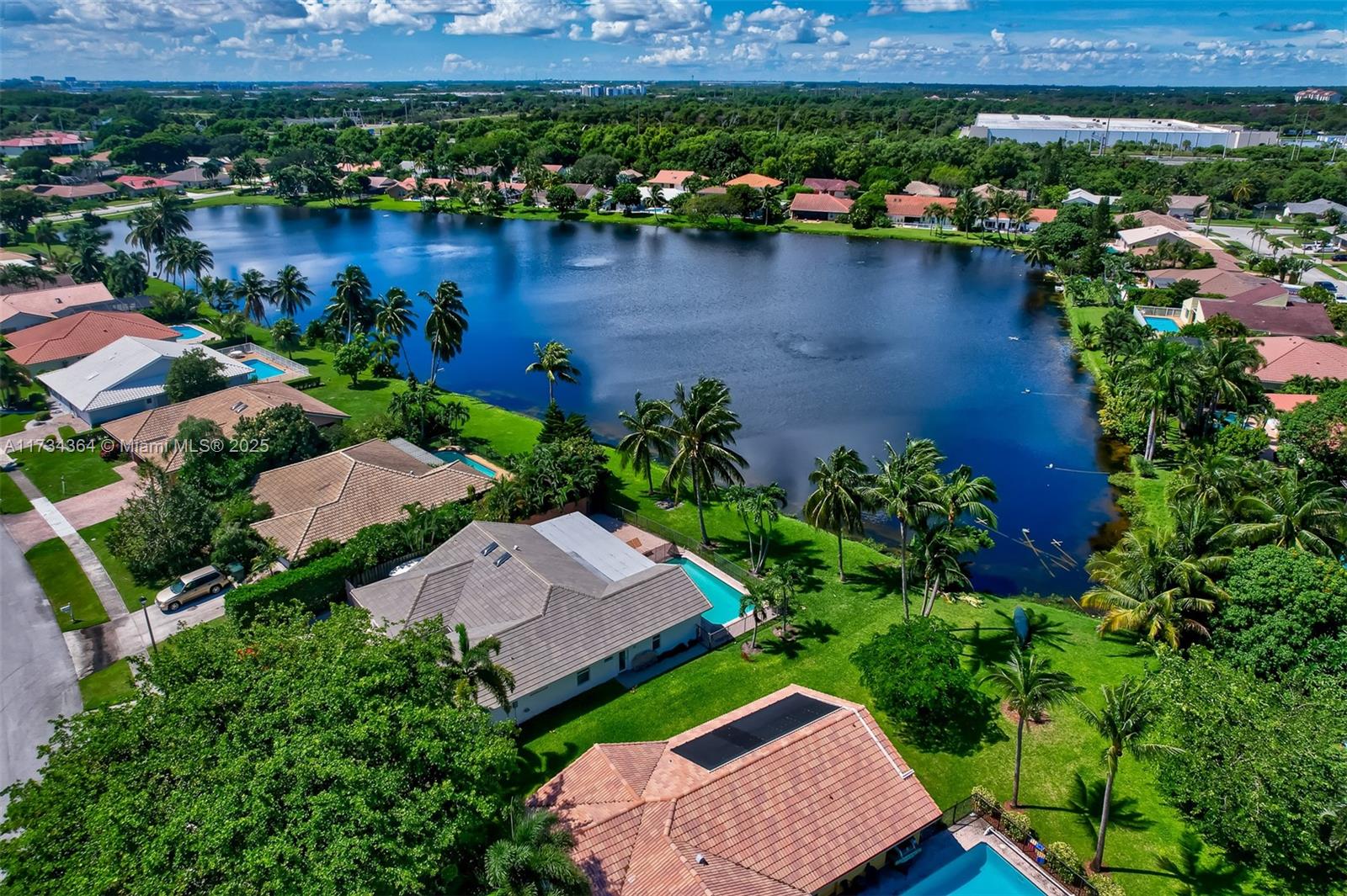 7260 Northwest 4th Avenue Boca Raton, FL 33487 - Photo 6 of 59 an aerial view of a house with outdoor space and lake view