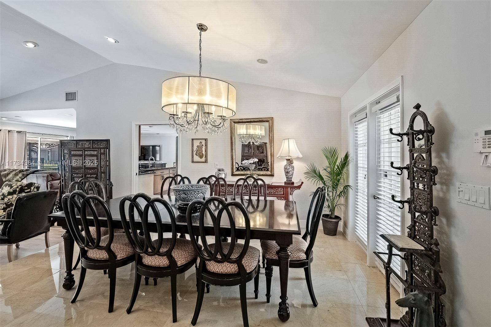 7260 Northwest 4th Avenue Boca Raton, FL 33487 - Photo 10 of 59 a view of a dining room with furniture window and wooden floor