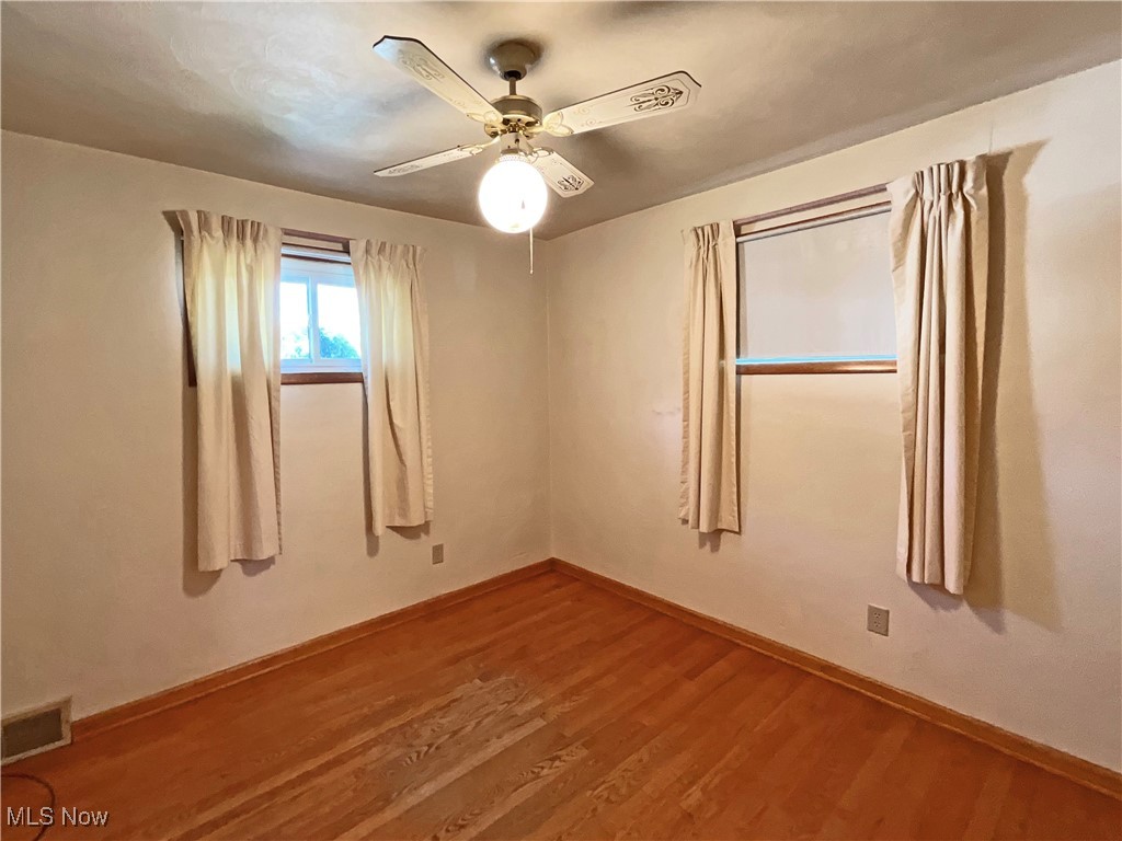 106 Ridgeway Avenue Weirton, WV 26062 - Photo 12 of 19 Unfurnished room featuring ceiling fan and hardwood / wood-style floors