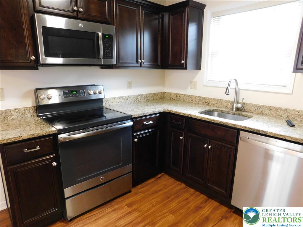 821 Masslich Street Bethlehem, PA 18018 - Photo 10 of 23 a kitchen with a sink and a microwave