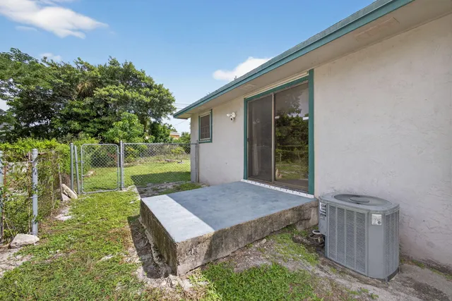a view of backyard with a garden and deck