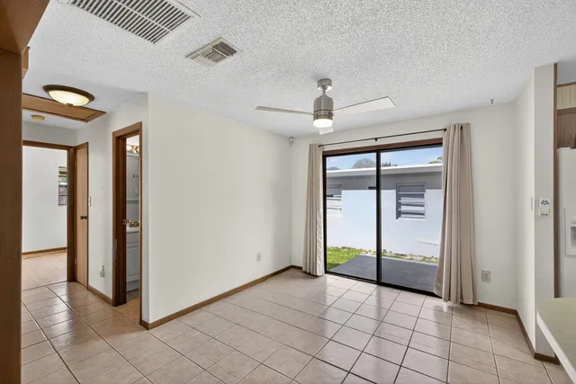 a view of a kitchen with furniture and a window