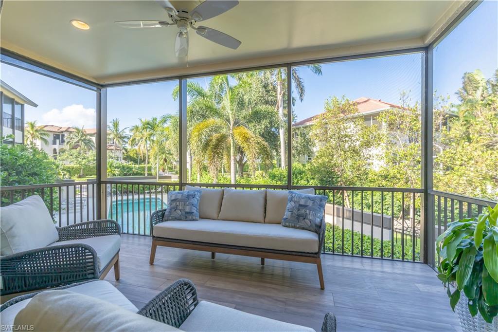 651 10th Avenue South, Unit C651 Naples, FL 34102 - Photo 25 of 32 a living room with furniture and a large window