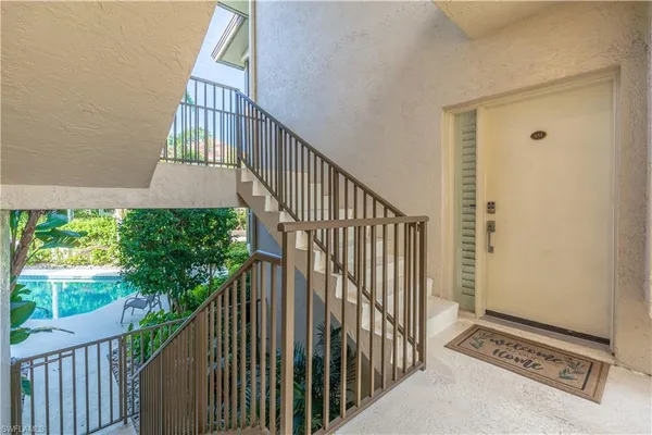 a view of stairs and wooden floor