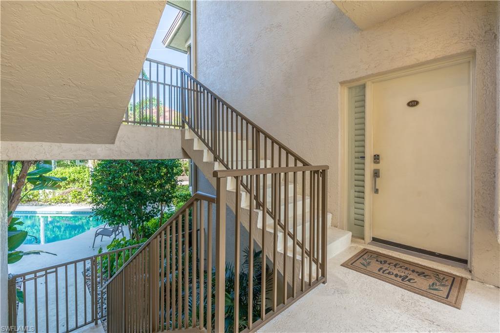 651 10th Avenue South, Unit C651 Naples, FL 34102 - Photo 27 of 32 a view of stairs and wooden floor