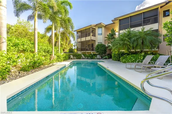 a view of a swimming pool with a patio