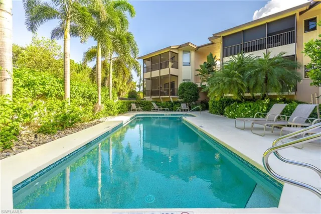 a view of a swimming pool with a patio