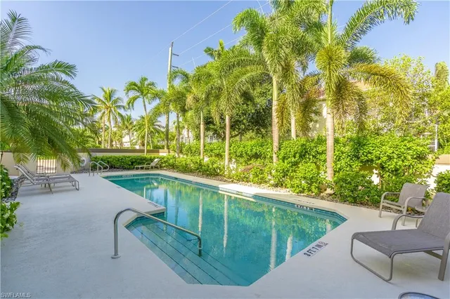 a view of a swimming pool with a patio