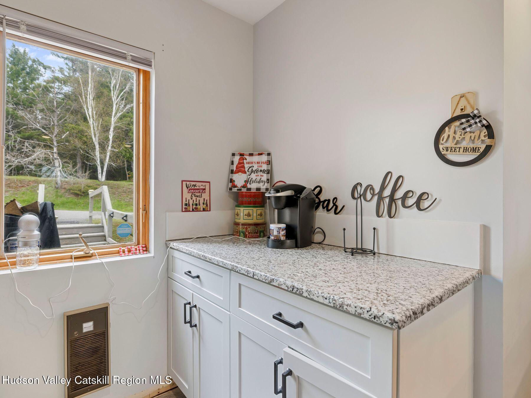 55 Windham Ridge Road, Unit 15H Windham, NY 12496 - Photo 12 of 34 a view of a kitchen counter space and a window