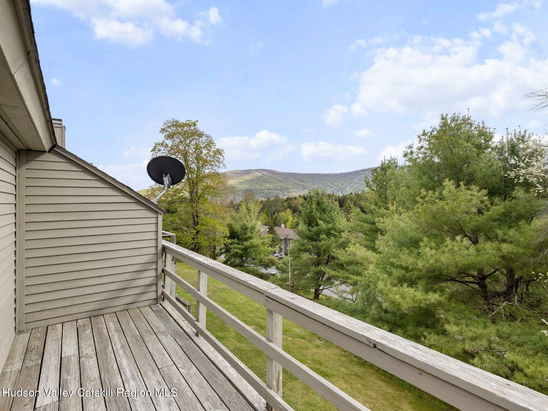 55 Windham Ridge Road, Unit 15H Windham, NY 12496 - Photo 26 of 34 a view of balcony with wooden floor