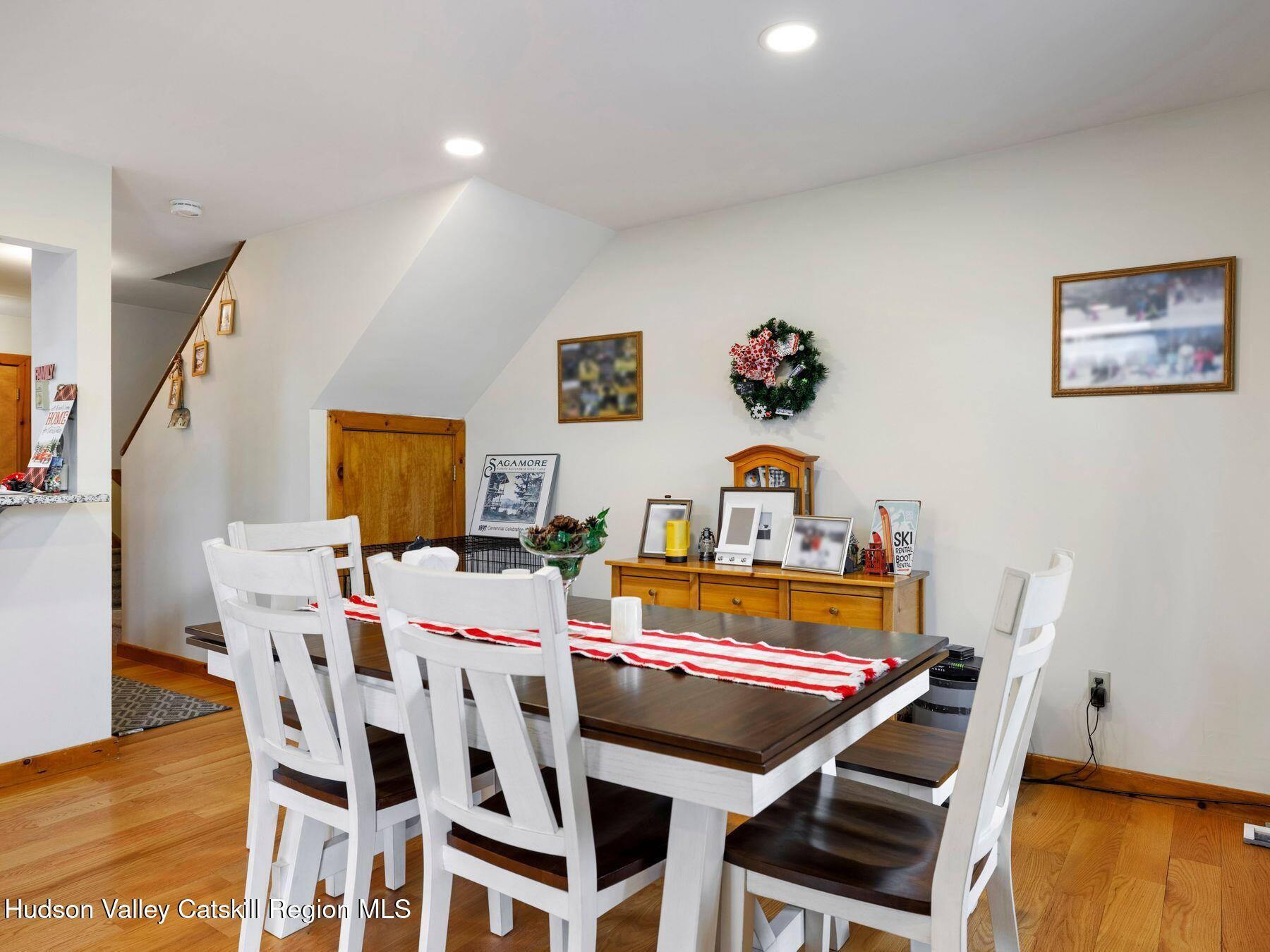 55 Windham Ridge Road, Unit 15H Windham, NY 12496 - Photo 7 of 34 a dining room with furniture and wooden floor