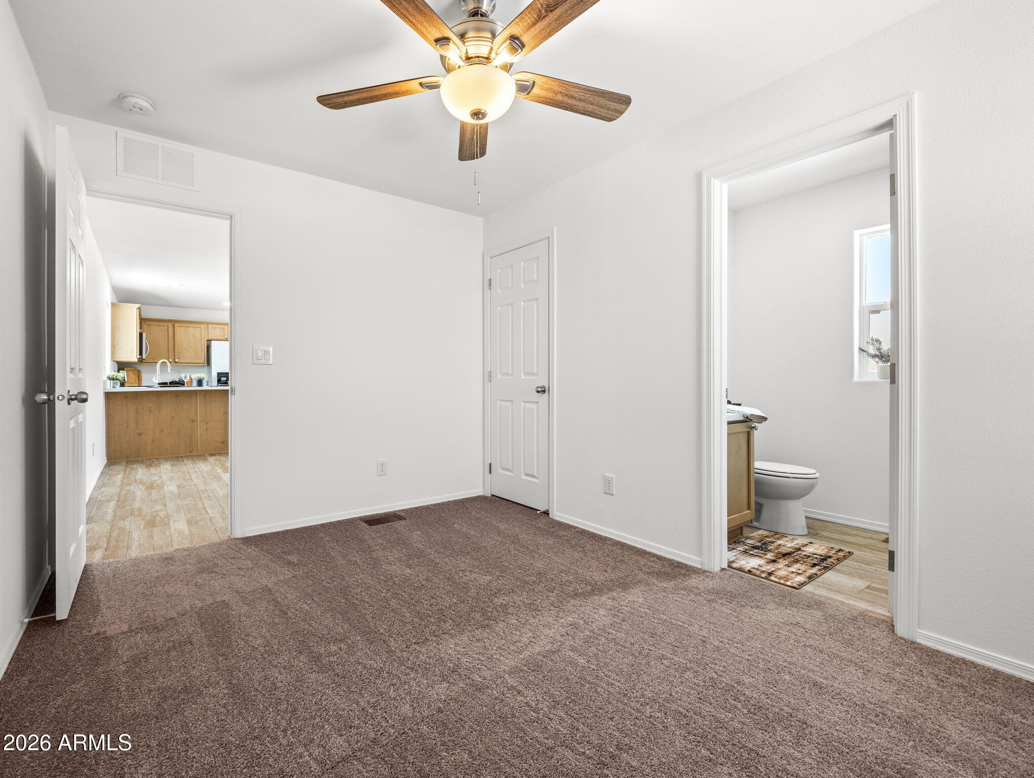 18296 Frontier Road Peeples Valley, AZ 86332 - Photo 24 of 44 a view of a room with a sink and a chandelier fan