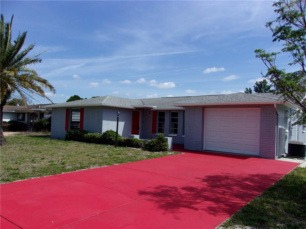 11200 Linden Lane Port Richey, FL 34668 - Photo 1 of 1 a house view with a garden space