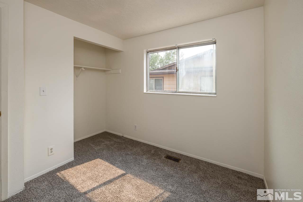 6885 Lotus Street Reno, NV 89506 - Photo 8 of 11 an empty room with windows
