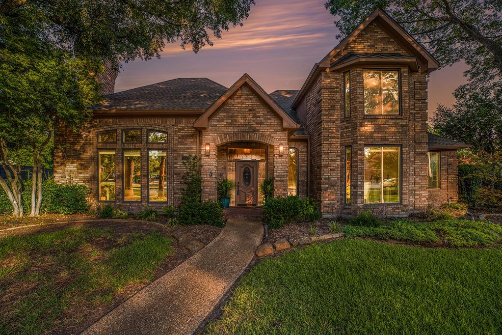 1099 Edith Circle Richardson, TX 75080 - Photo 1 of 1 a front view of a house with garden