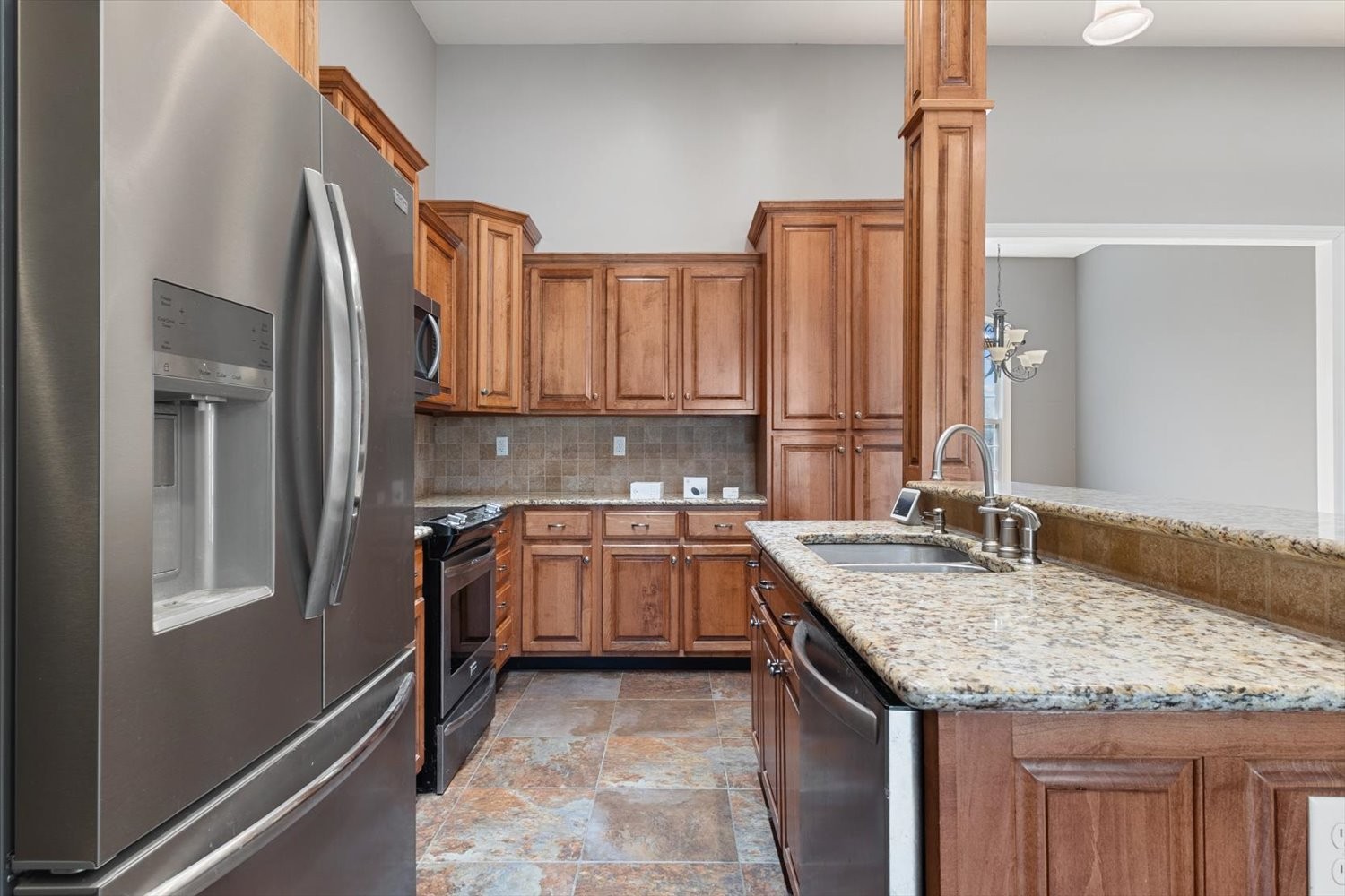 31 Chickory Lane Monteagle, TN 37356 - Photo 14 of 61 a kitchen with granite countertop kitchen island a sink appliances and cabinets