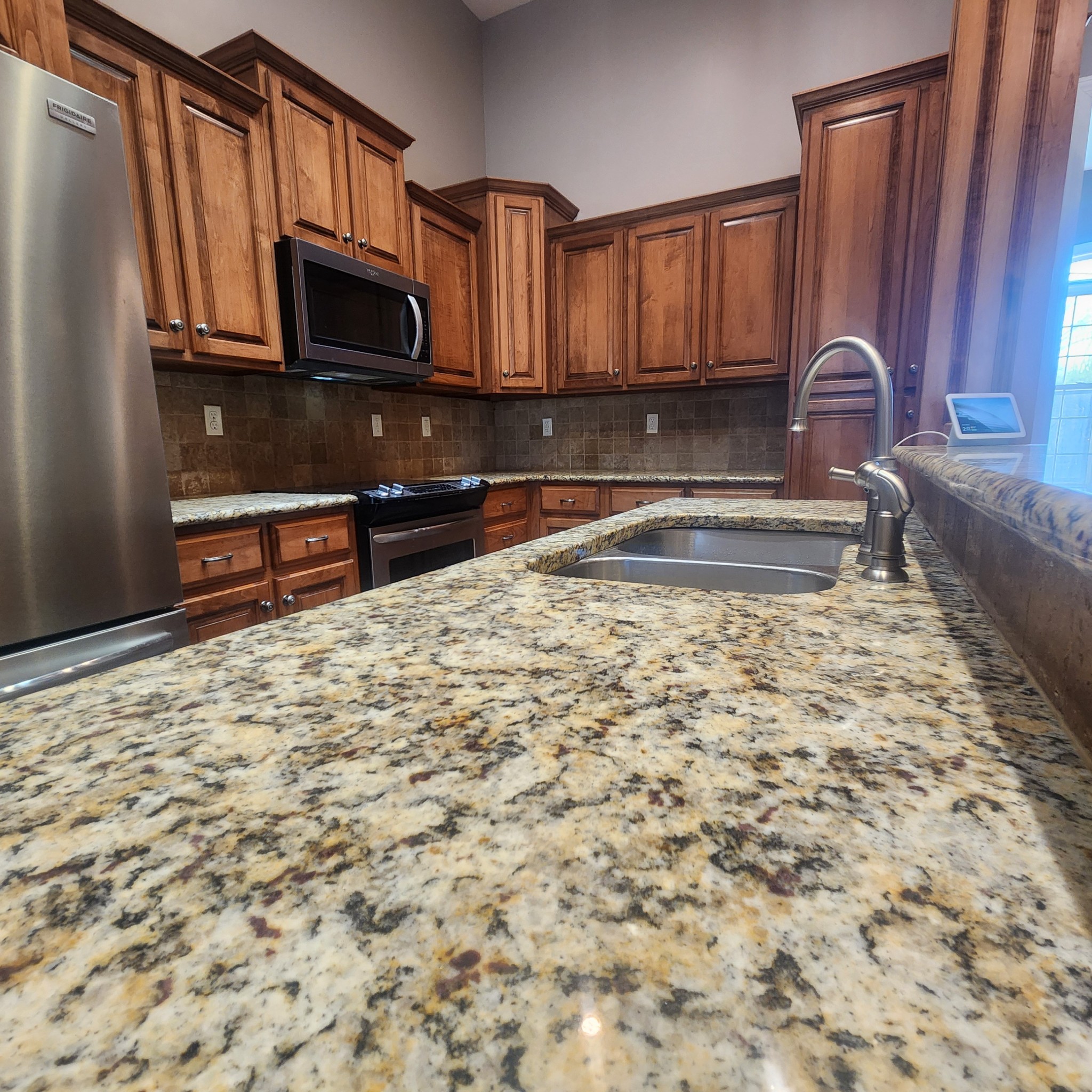 31 Chickory Lane Monteagle, TN 37356 - Photo 16 of 53 a kitchen with granite countertop a sink stove and microwave