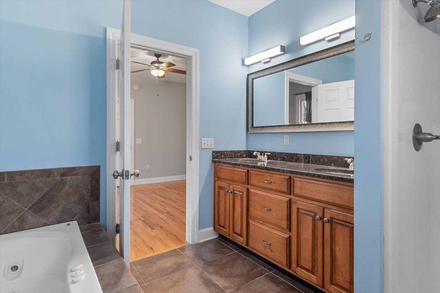 31 Chickory Lane Monteagle, TN 37356 - Photo 23 of 53 a bathroom with a sink a mirror and a vanity