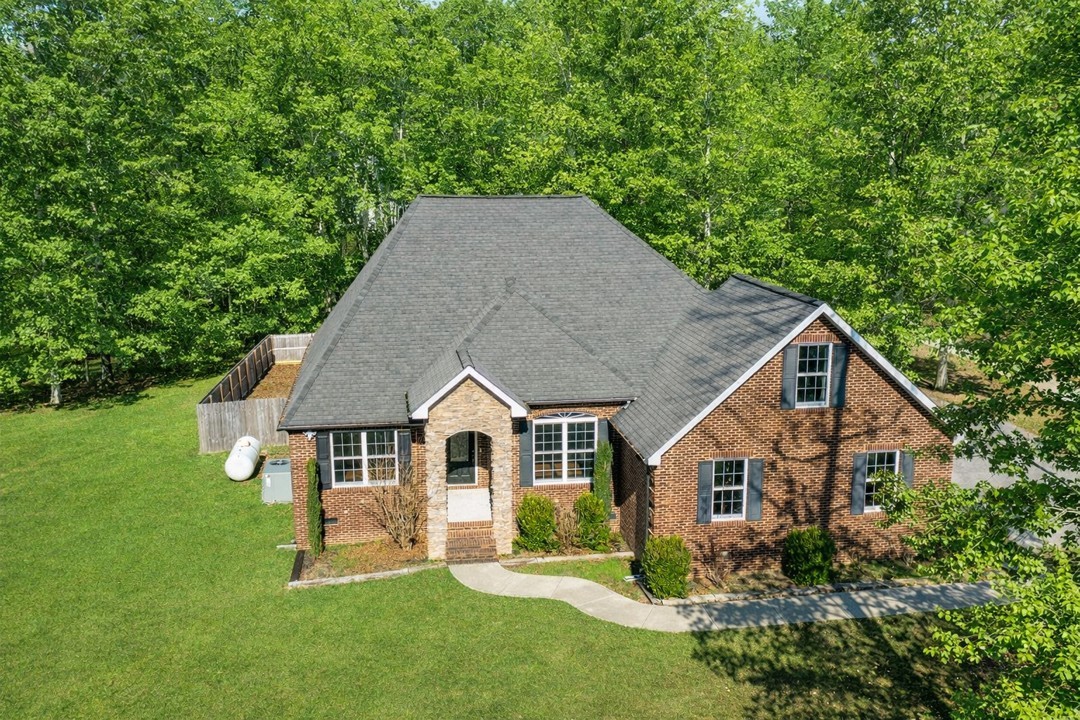 31 Chickory Lane Monteagle, TN 37356 - Photo 3 of 61 a aerial view of a house with a yard porch and furniture