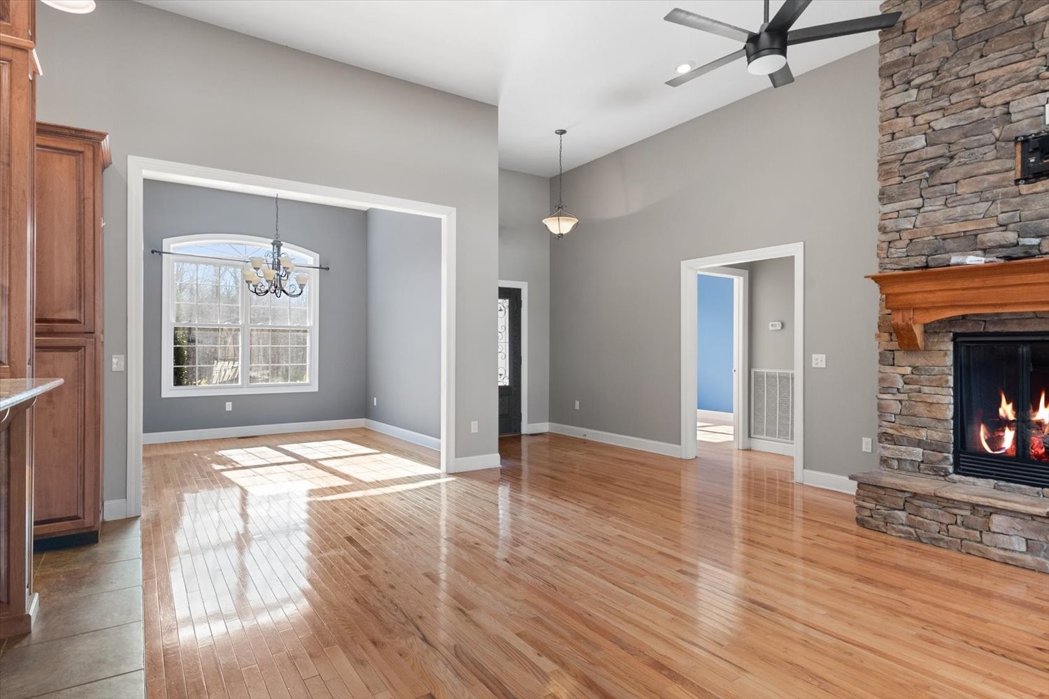 31 Chickory Lane Monteagle, TN 37356 - Photo 10 of 61 an empty room with wooden floor a fireplace and windows