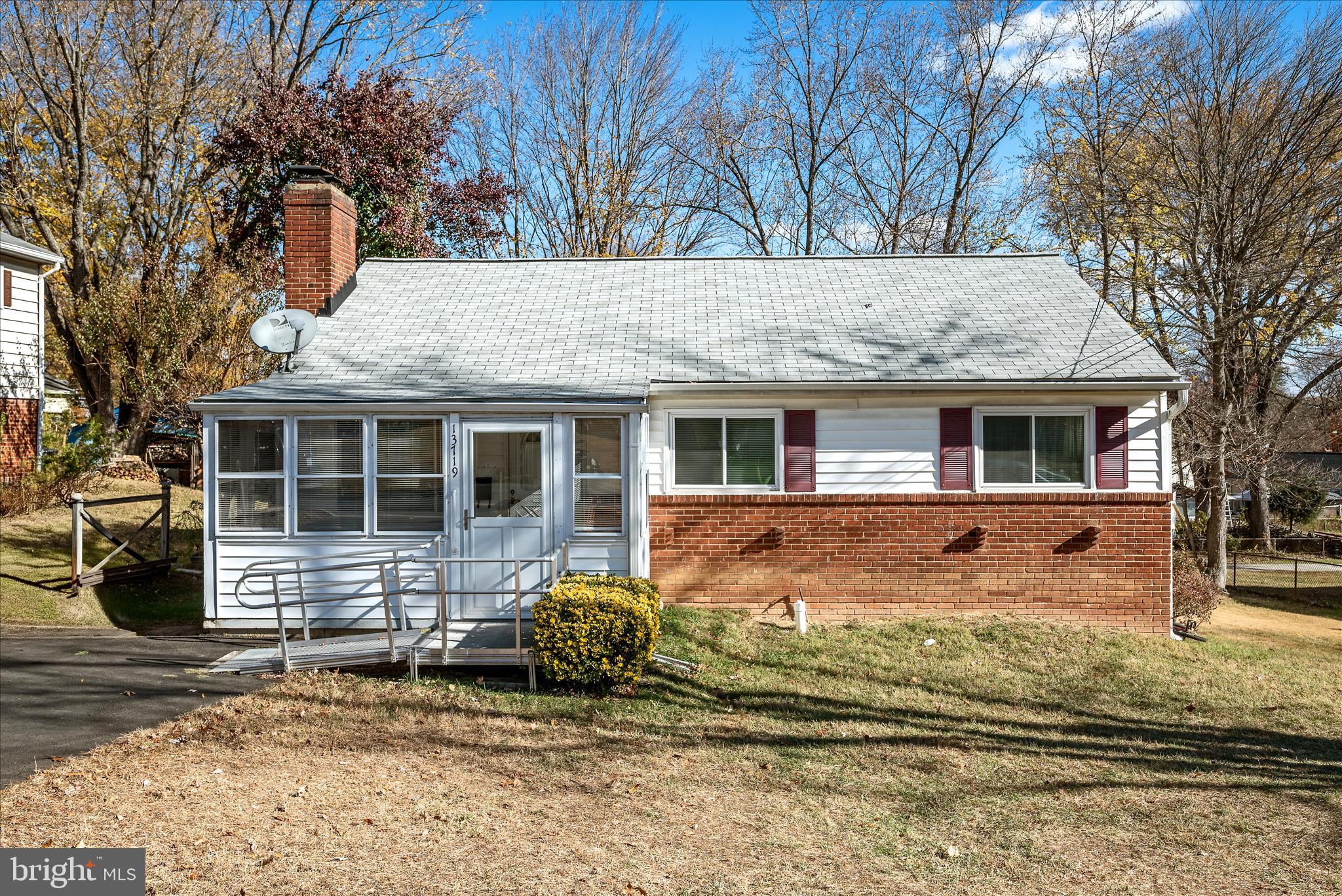 a view of house with backyard of house