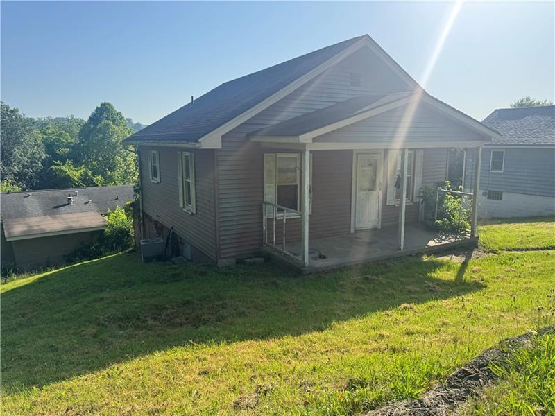 112 Wide Street Houston, PA 15342 - Photo 1 of 7 a backyard of a house with seating space