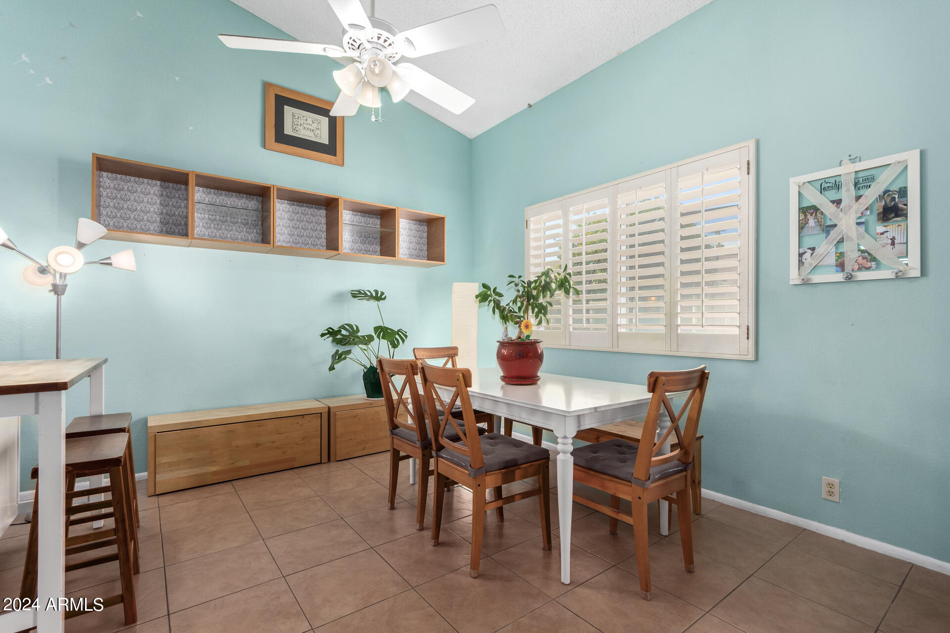 6516 West Mountain View Road Glendale, AZ 85302 - Photo 11 of 35 a view of a dining room with furniture and chandelier