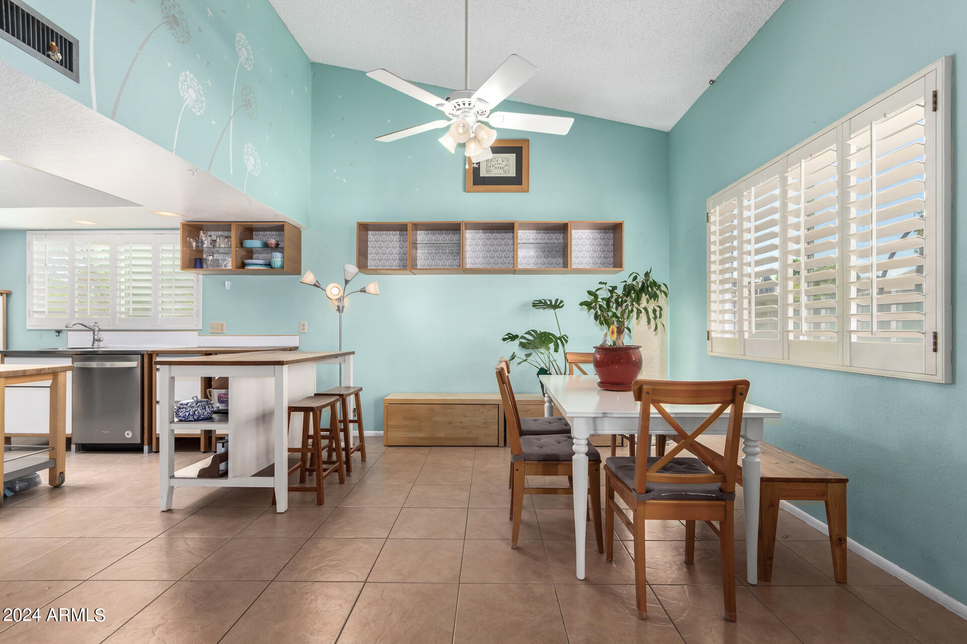 6516 West Mountain View Road Glendale, AZ 85302 - Photo 12 of 35 a view of a dining room with furniture and a chandelier