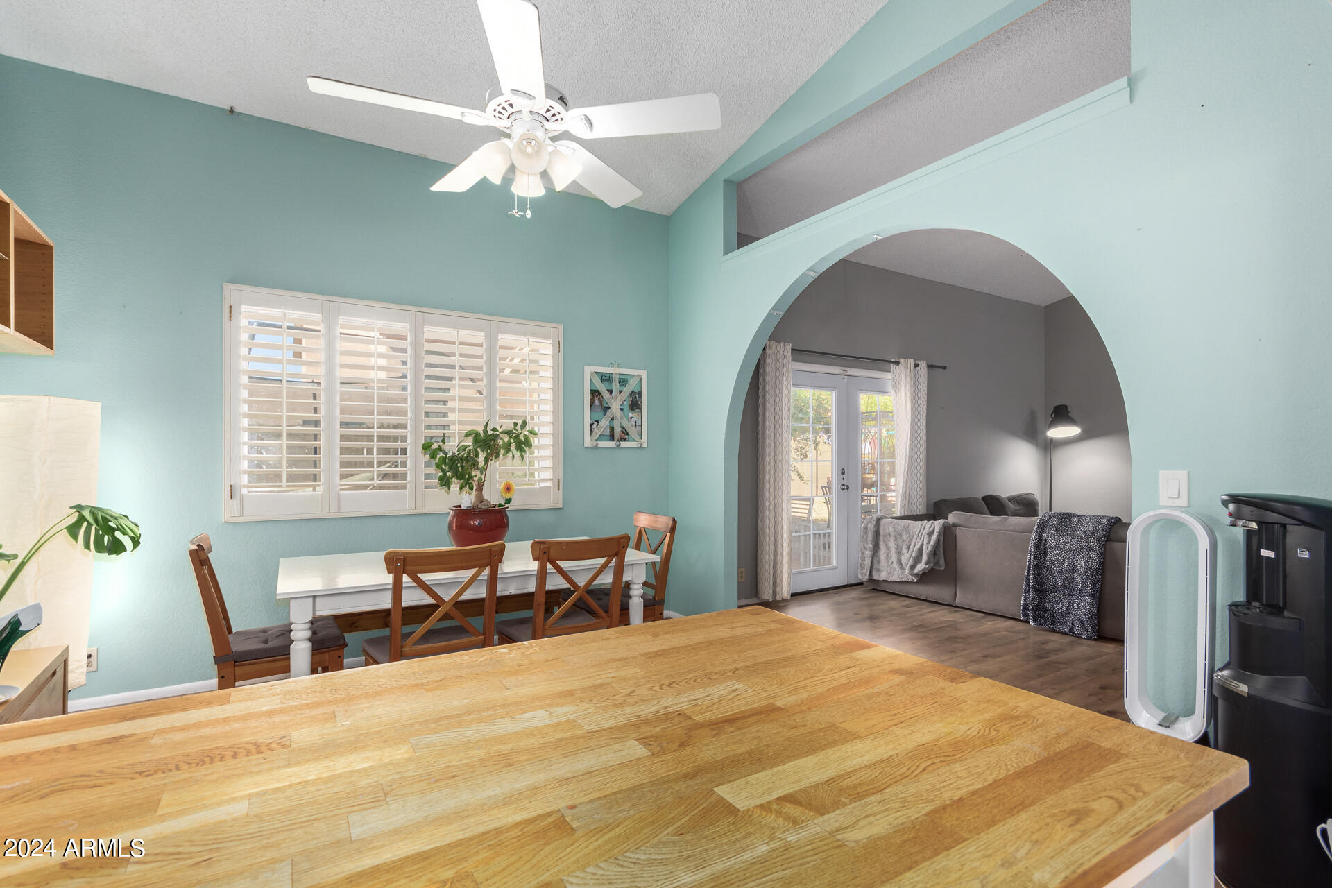 6516 West Mountain View Road Glendale, AZ 85302 - Photo 13 of 35 a view of a dining room with furniture window and wooden floor