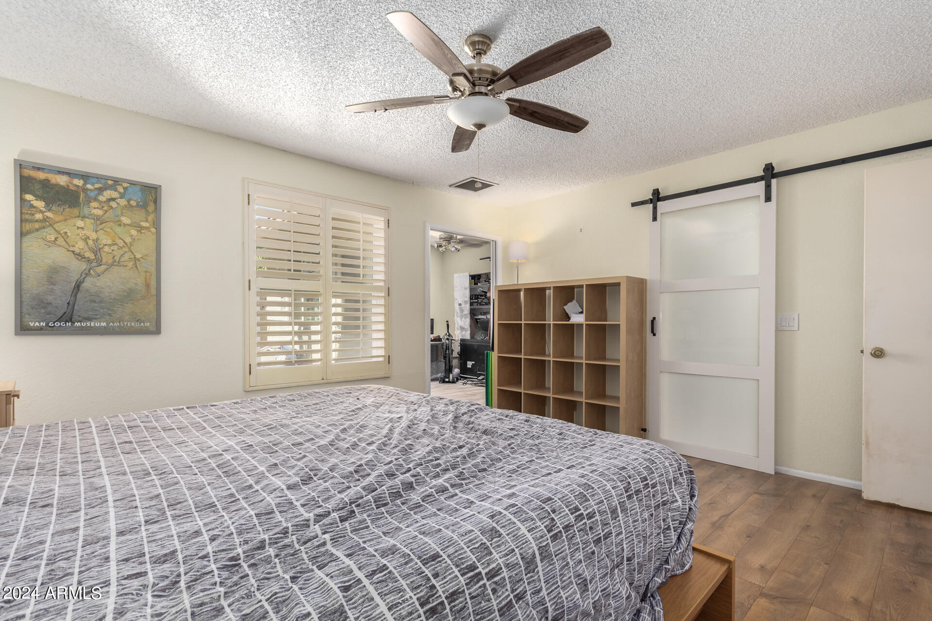 6516 West Mountain View Road Glendale, AZ 85302 - Photo 22 of 35 a bedroom with a bed and a window