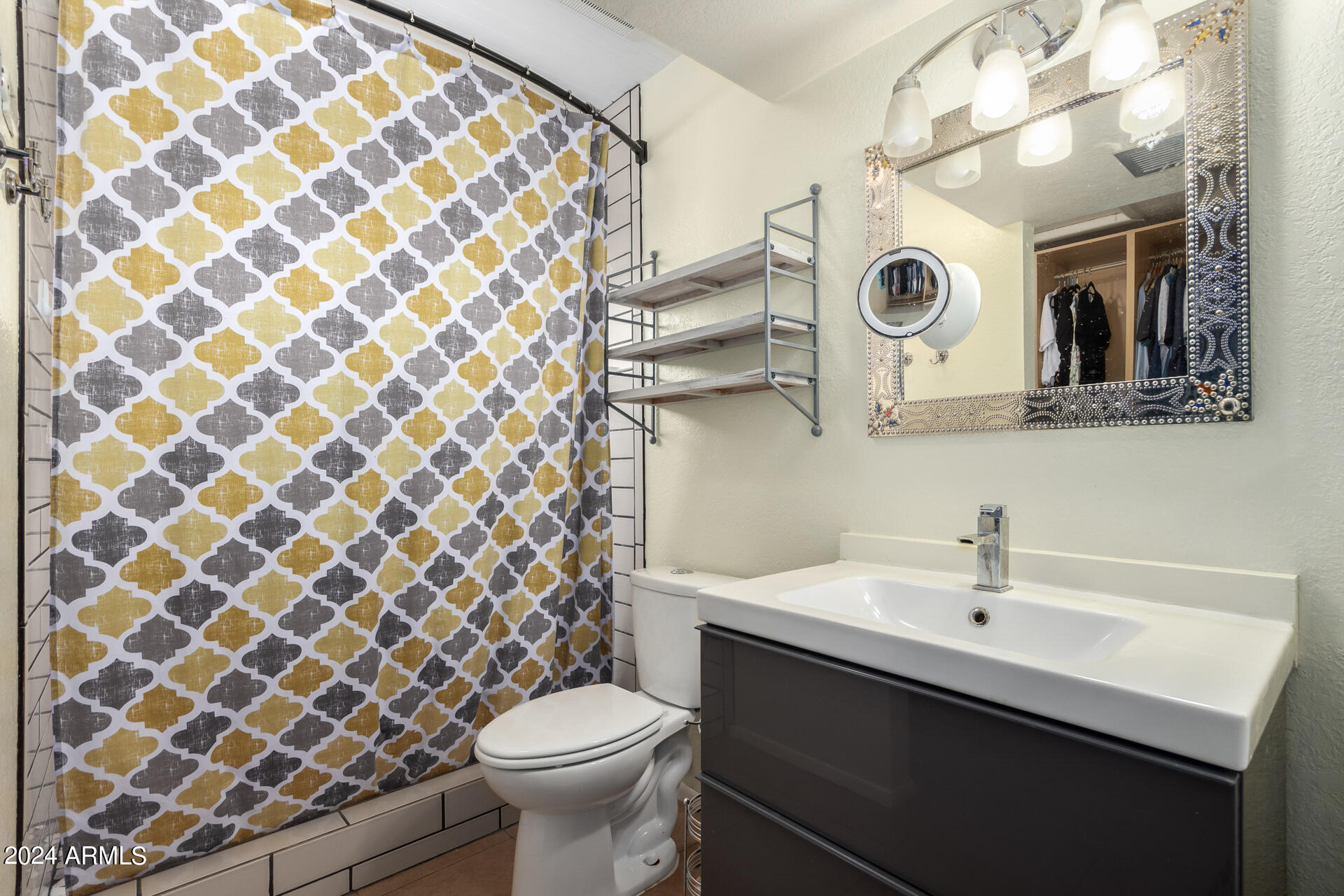 6516 West Mountain View Road Glendale, AZ 85302 - Photo 24 of 35 a bathroom with a sink and a mirror