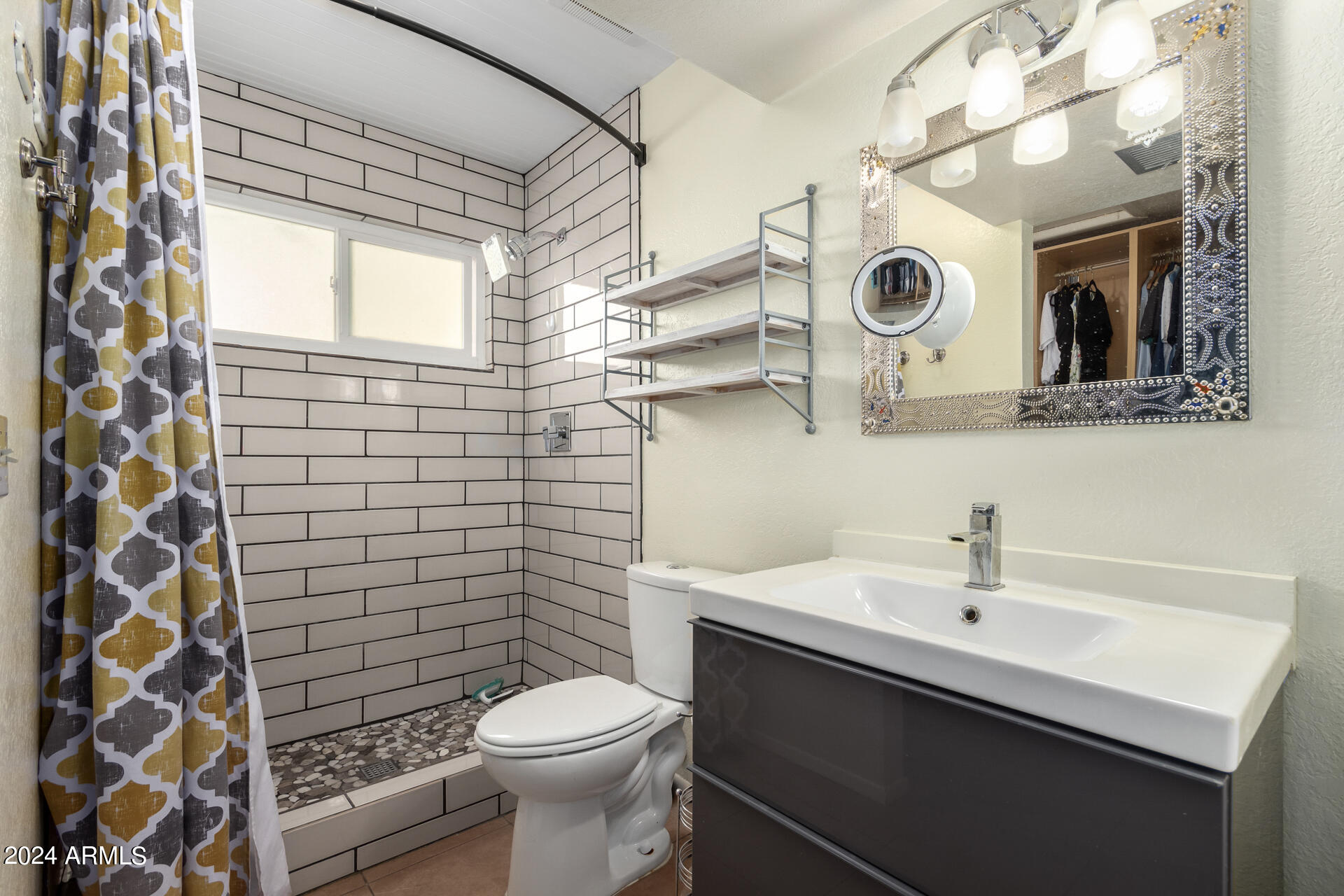 6516 West Mountain View Road Glendale, AZ 85302 - Photo 25 of 35 a bathroom with a sink and a mirror