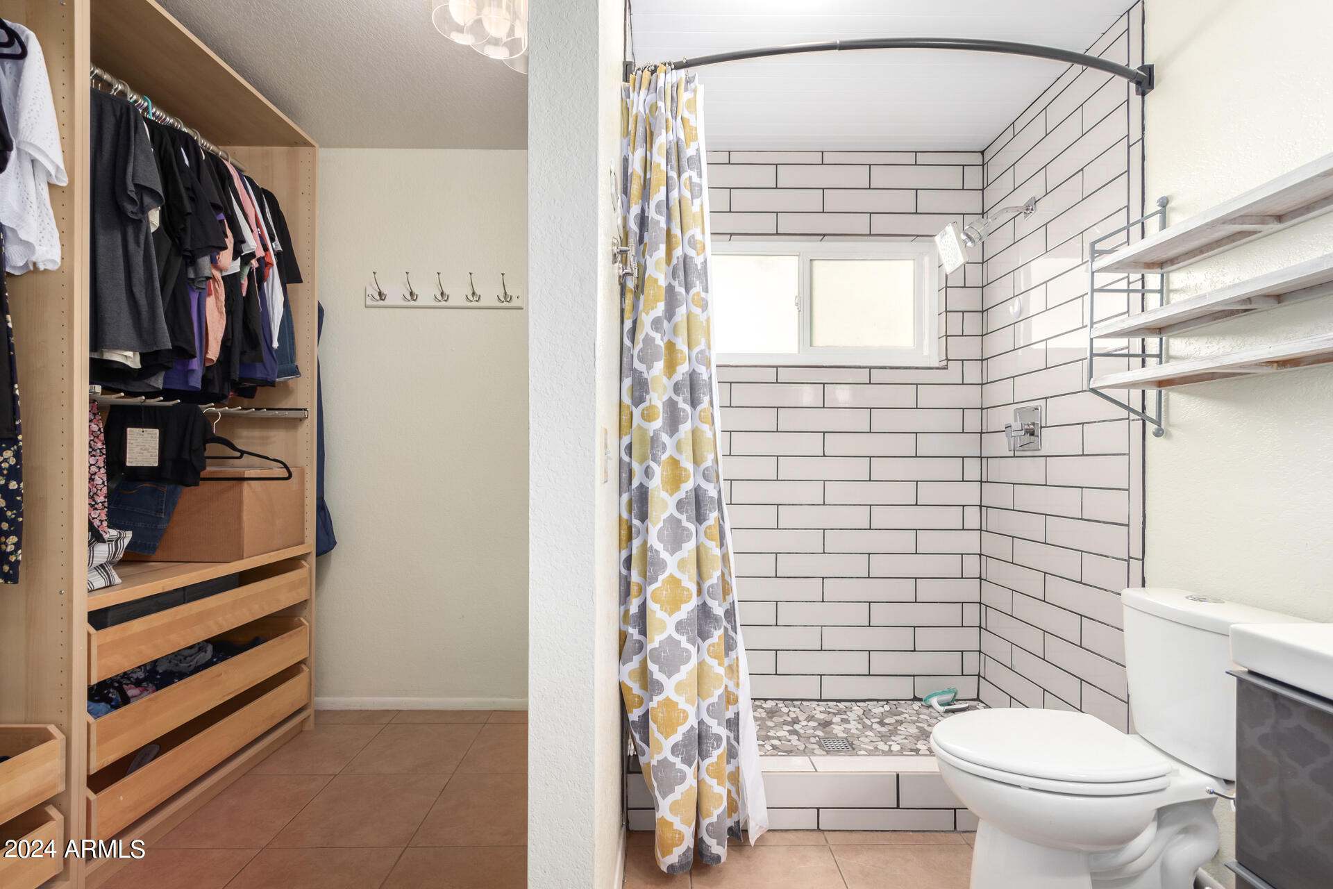 6516 West Mountain View Road Glendale, AZ 85302 - Photo 27 of 35 a bathroom with a toilet a sink and a shower