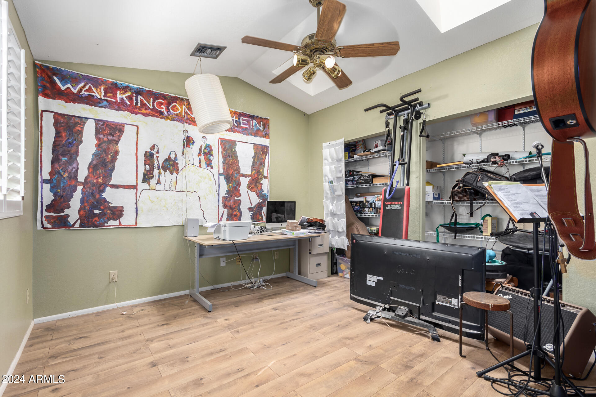 6516 West Mountain View Road Glendale, AZ 85302 - Photo 28 of 35 a room with gym equipment and a window