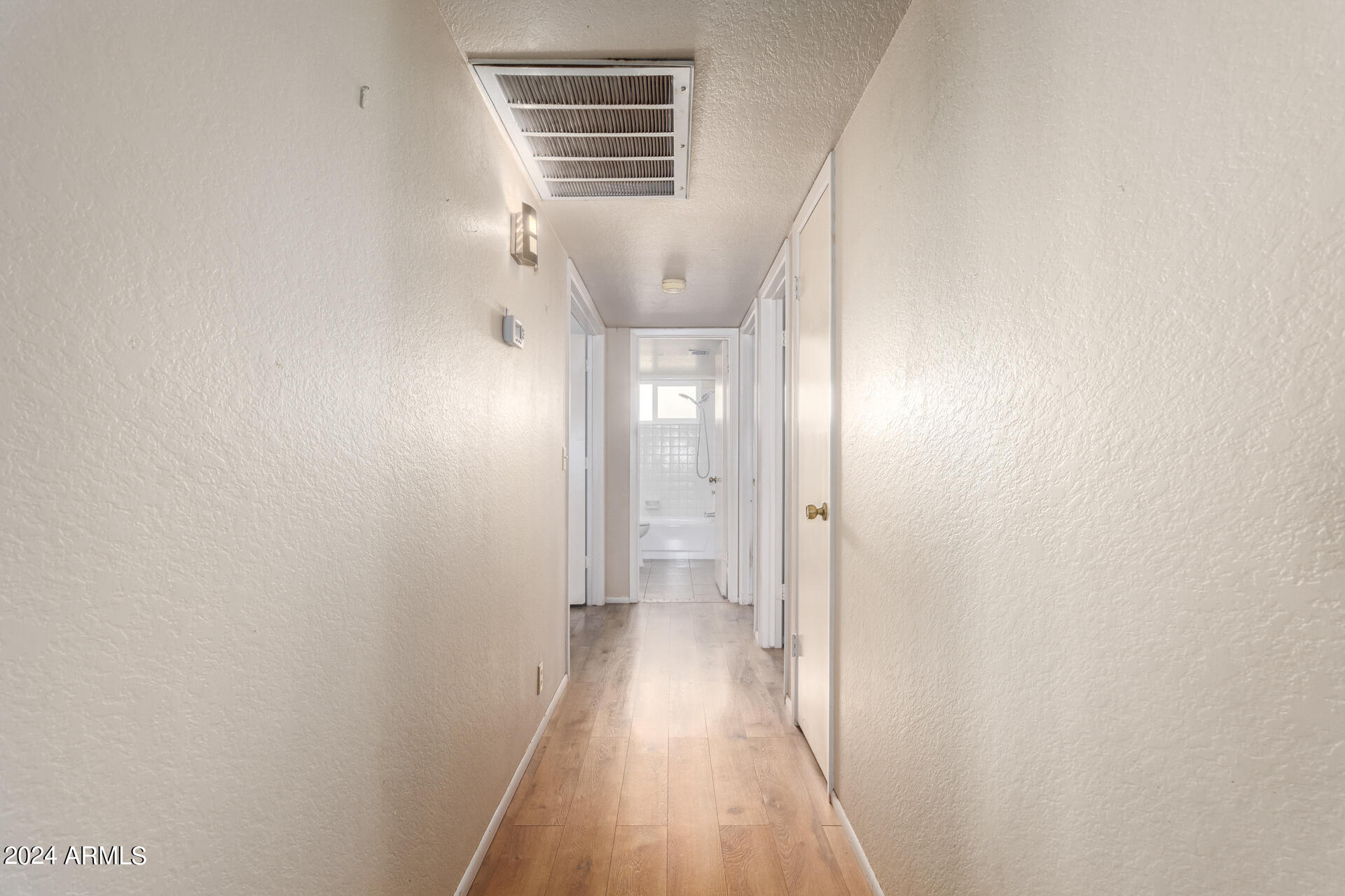 6516 West Mountain View Road Glendale, AZ 85302 - Photo 35 of 35 a view of hallway with wooden floor