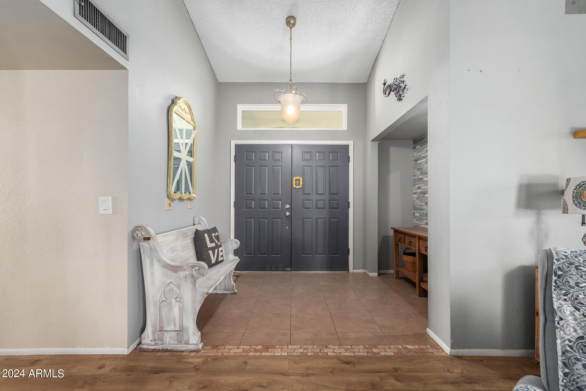 6516 West Mountain View Road Glendale, AZ 85302 - Photo 5 of 35 a view of an entryway with a chandelier