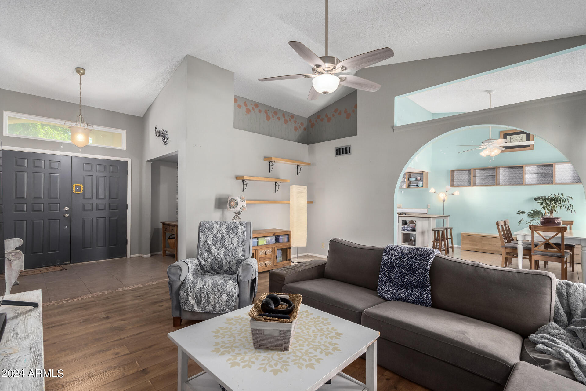 6516 West Mountain View Road Glendale, AZ 85302 - Photo 6 of 35 a living room with furniture and a chandelier