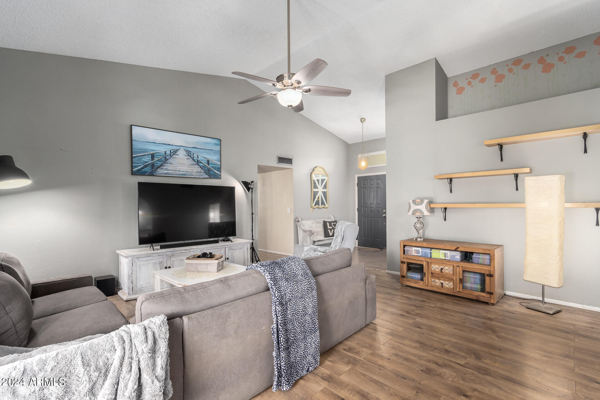 6516 West Mountain View Road Glendale, AZ 85302 - Photo 7 of 35 a living room with furniture and a flat screen tv