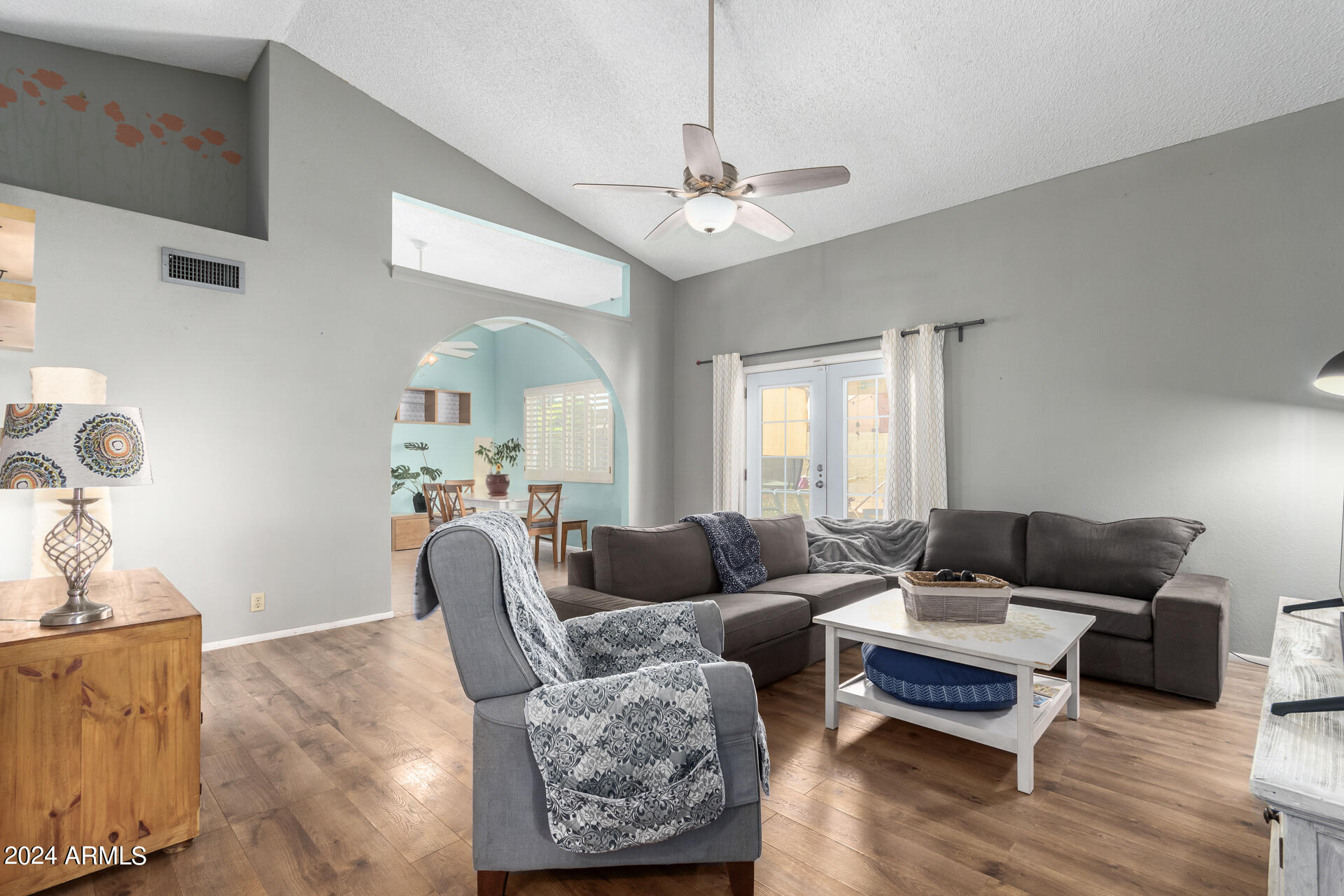 6516 West Mountain View Road Glendale, AZ 85302 - Photo 8 of 35 a living room with furniture and wooden floor