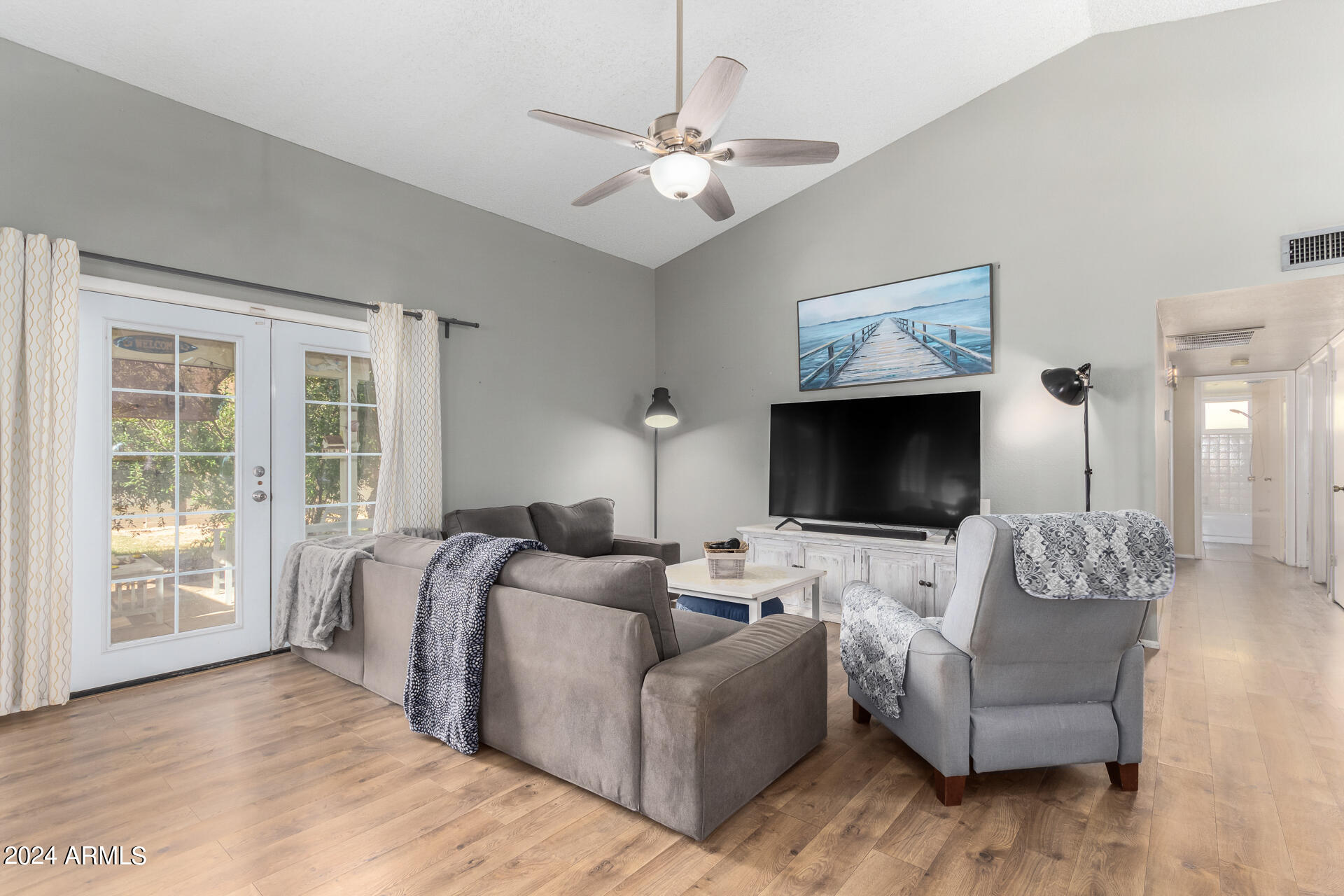 6516 West Mountain View Road Glendale, AZ 85302 - Photo 9 of 35 a living room with furniture and a flat screen tv