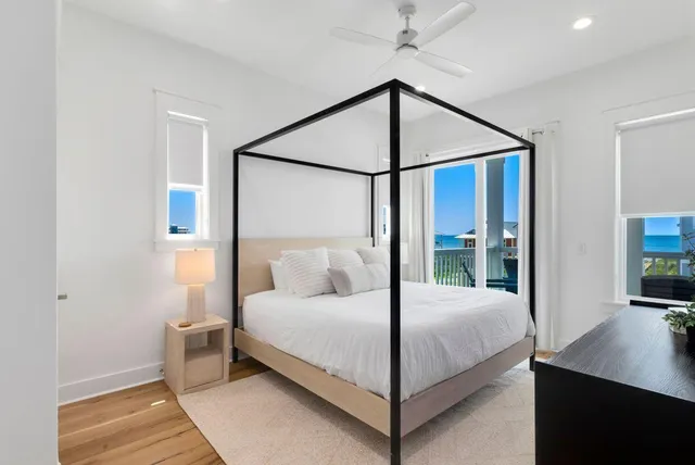 a spacious bathroom with a granite countertop sink mirror and shower